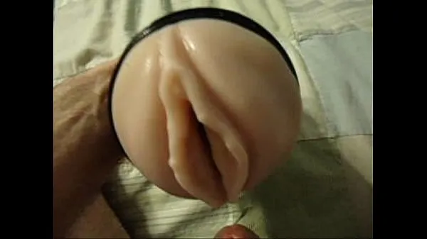 Mira Dakota's hard cock in a fleshlight power tube