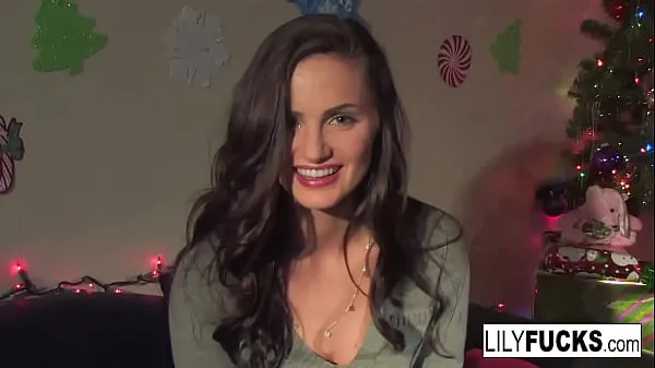 Se Lily tells us her horny Christmas wishes before satisfying herself in both holes power Tube